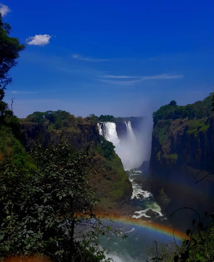Victoria Falls with rainbow at full flow